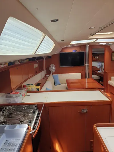  Yacht Photos Pics Interior of 2008 Beneteau Oceanis 50 yacht with modern kitchen and cozy seating area.