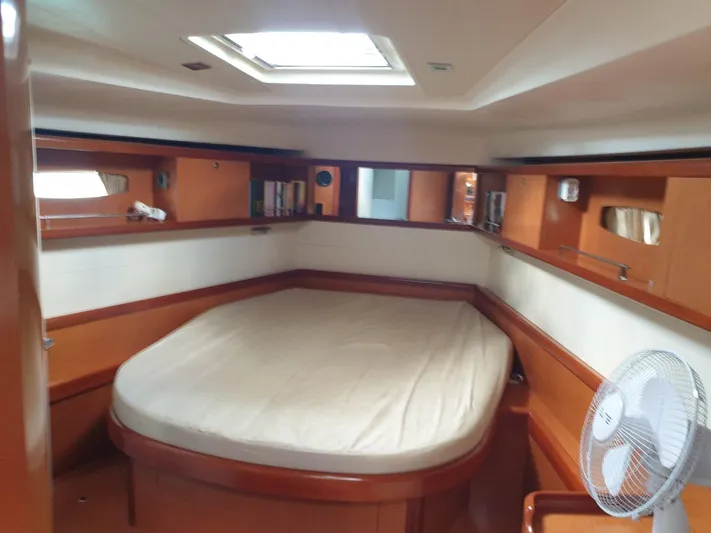  Yacht Photos Pics Cabin interior of 2008 Beneteau Oceanis 50 yacht with bed and fan.