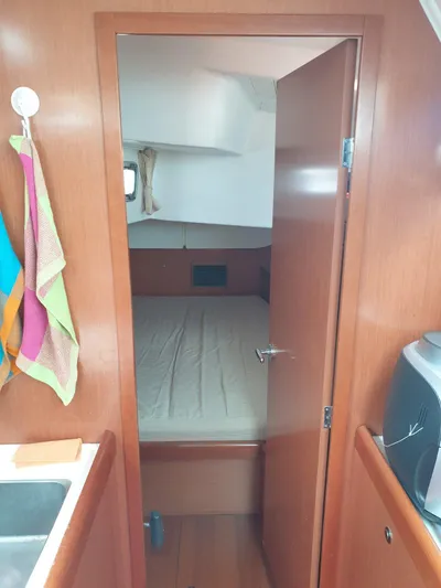  Yacht Photos Pics Interior cabin view of 2008 Beneteau Oceanis 50 sailboat, featuring a cozy bedroom.