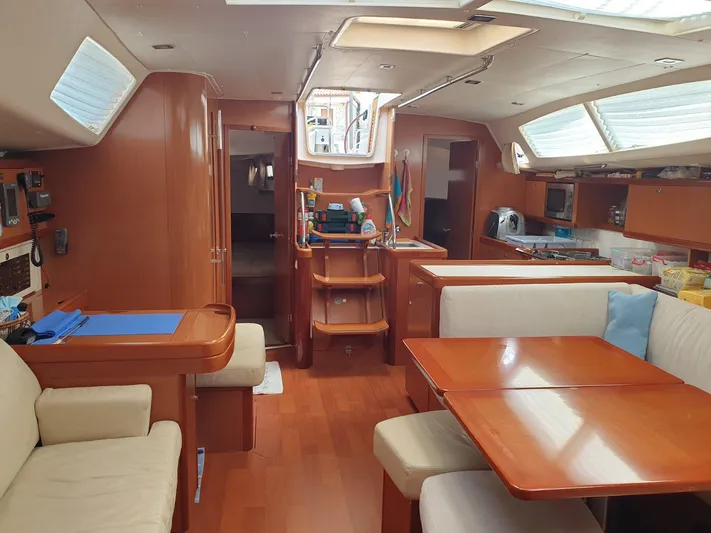  Yacht Photos Pics Interior of 2008 Beneteau Oceanis 50 yacht with wood finish and spacious seating area.