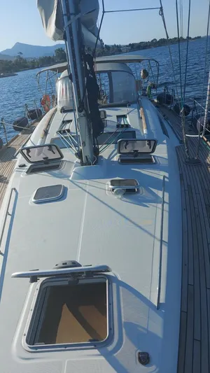  Yacht Photos Pics 2008 Beneteau Oceanis 50 sailboat deck with open hatches, sailing on calm waters.