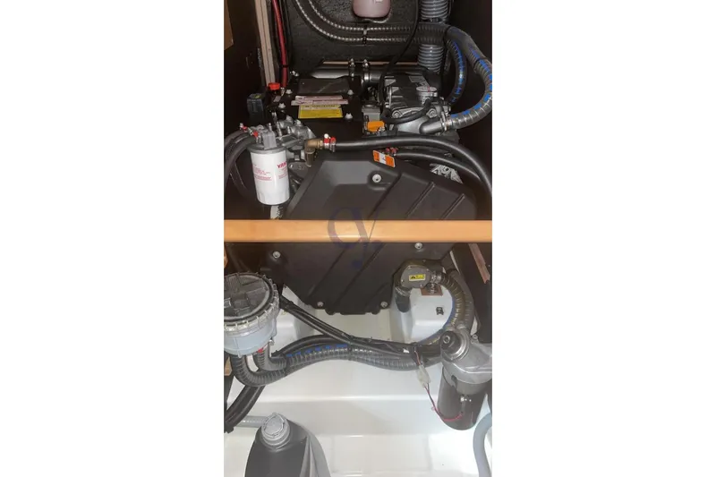 A Yacht Photos Pics Engine compartment of 2018 Beneteau Oceanis 45 sailboat, showcasing mechanical components.