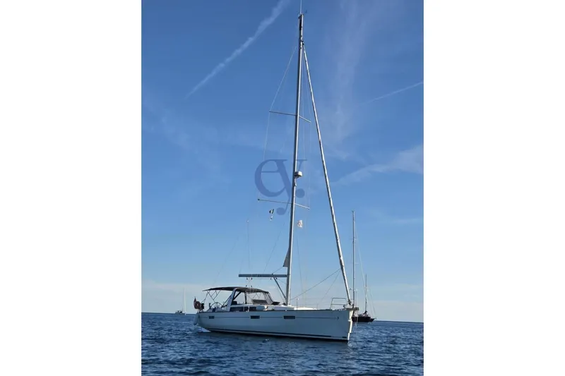 A Yacht Photos Pics 2018 Beneteau Oceanis 45 sailboat on calm sea under clear blue sky.