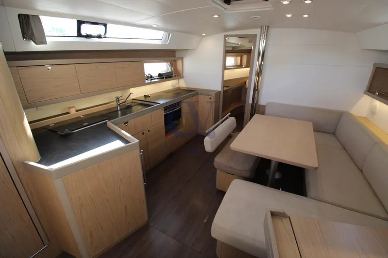 A Yacht Photos Pics Interior of 2018 Beneteau Oceanis 45 yacht, featuring modern kitchen and dining area.