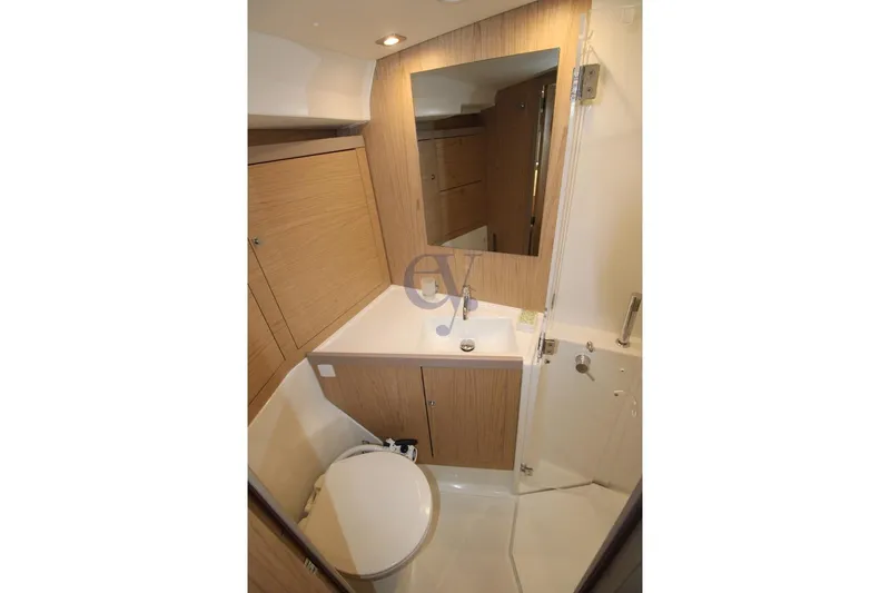 A Yacht Photos Pics Bathroom interior of 2018 Beneteau Oceanis 45 yacht, featuring modern fixtures and wood accents.