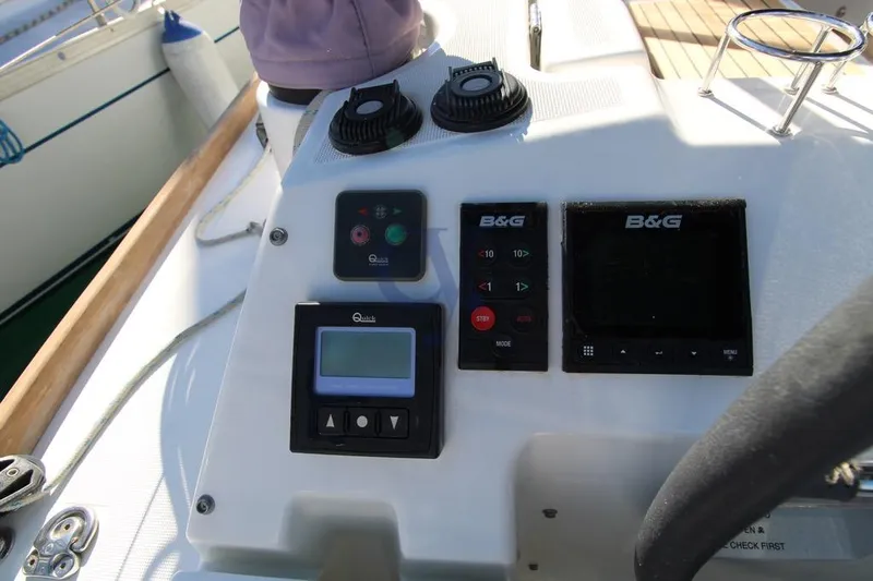A Yacht Photos Pics Control panel of a 2018 Beneteau Oceanis 45 sailboat with navigation instruments.