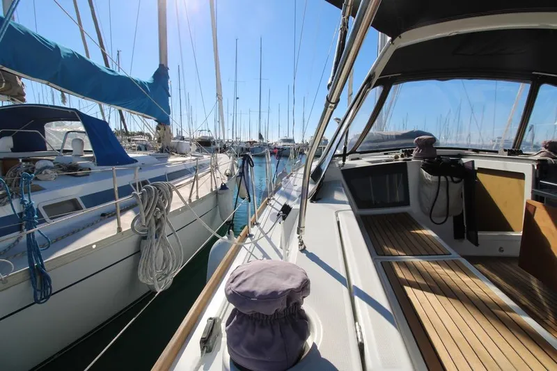 A Yacht Photos Pics Beneteau Oceanis 45 sailboat docked in a marina, 2018 model, sunny day.