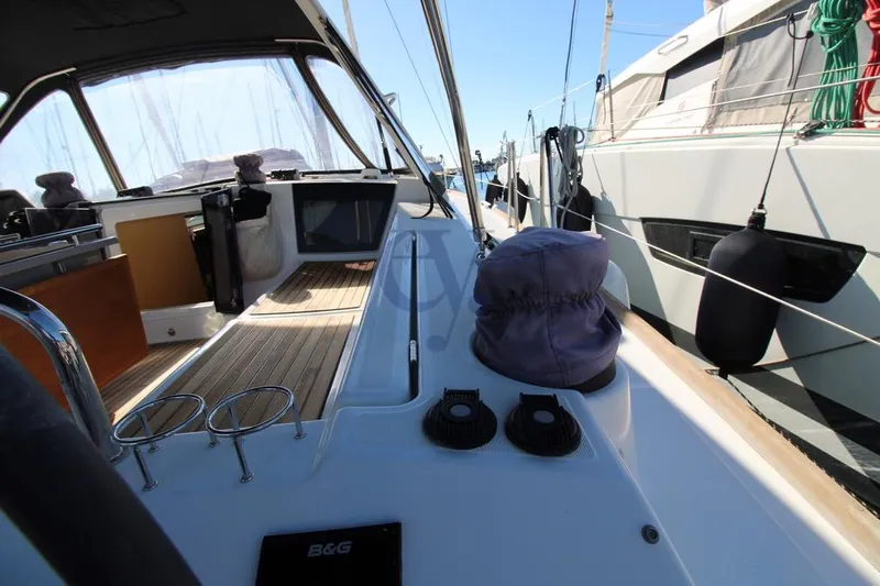A Yacht Photos Pics 2018 Beneteau Oceanis 45 yacht deck with modern cockpit and wooden flooring.