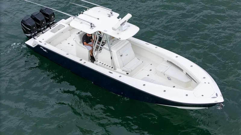  Yacht Photos Pics 2015 SeaVee 340Z boat on water, featuring triple outboard engines.