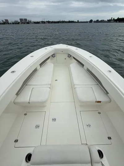  Yacht Photos Pics 2015 SeaVee 340Z boat with spacious deck and seating on calm water.