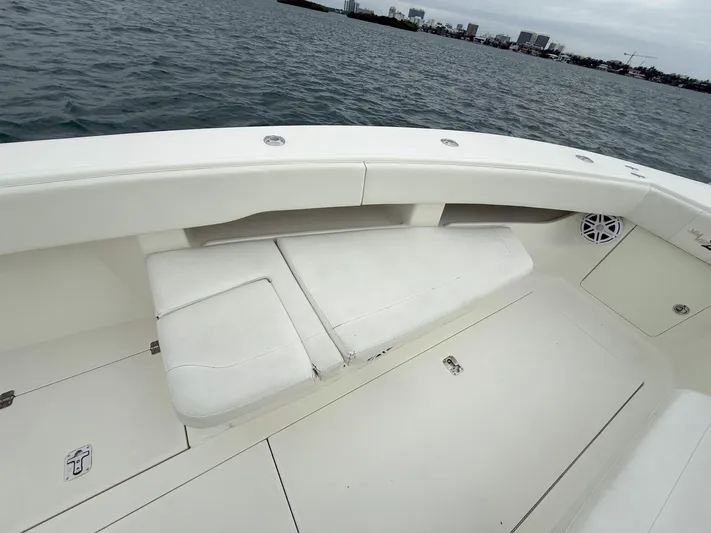  Yacht Photos Pics 2015 SeaVee 340Z boat interior with cushioned seating, on calm water.