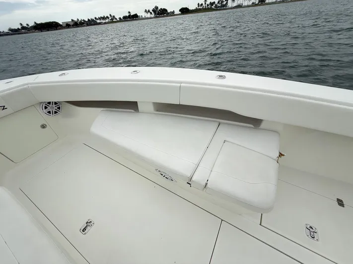  Yacht Photos Pics 2015 SeaVee 340Z boat interior with white seating, ocean view in background.