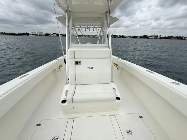  Yacht Photos Pics 2015 SeaVee 340Z boat on water, featuring spacious deck and seating.