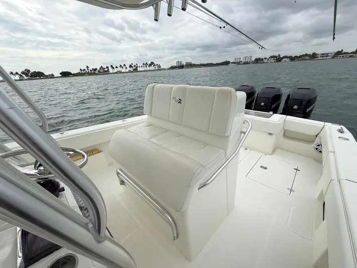  Yacht Photos Pics 2015 SeaVee 340Z boat interior with seating, ocean view, and triple outboard motors.