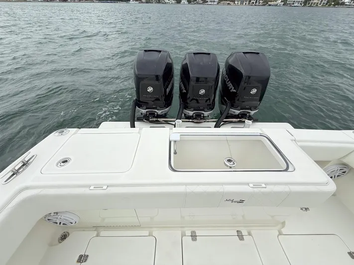  Yacht Photos Pics 2015 SeaVee 340Z boat with triple outboard engines on open water.