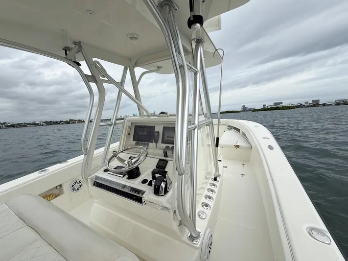  Yacht Photos Pics 2015 SeaVee 340Z boat interior with steering console on open water.
