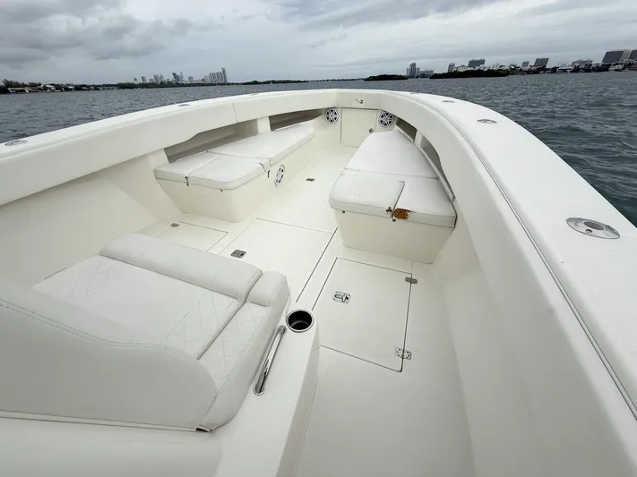  Yacht Photos Pics 2015 SeaVee 340Z boat interior with white seating and open deck on the water.