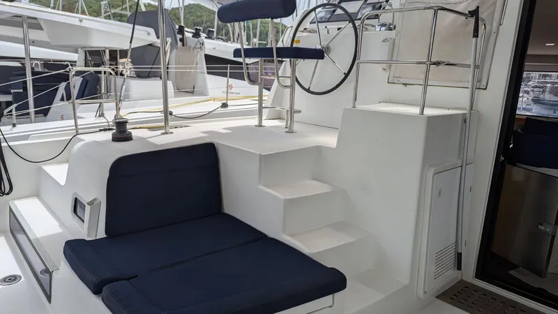 Mango IV Yacht Photos Pics Helm station of a 2017 Lagoon 42 catamaran with seating and steering wheel.