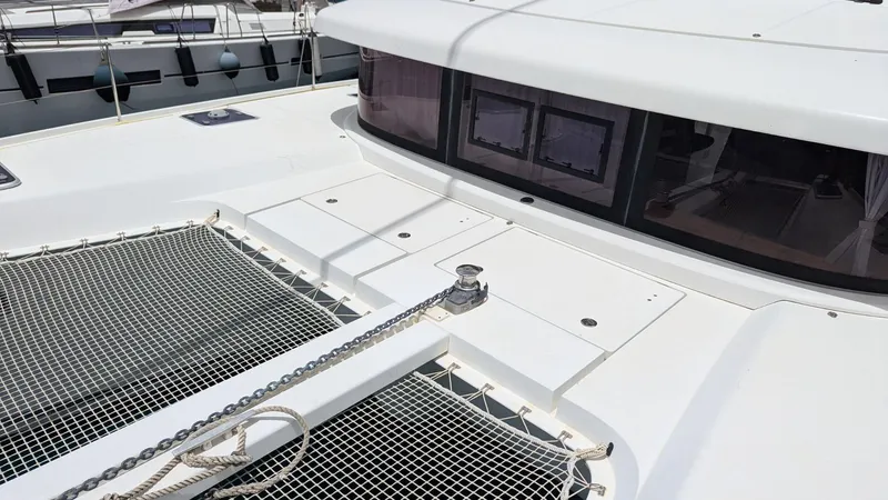 Mango IV Yacht Photos Pics 2017 Lagoon 42 catamaran deck with netting and windows.