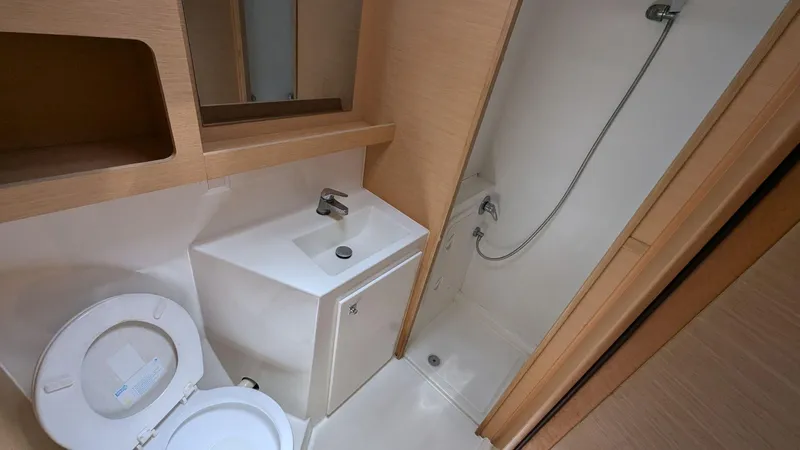 Mango IV Yacht Photos Pics Bathroom interior of 2017 Lagoon 42 yacht with shower, sink, and toilet.