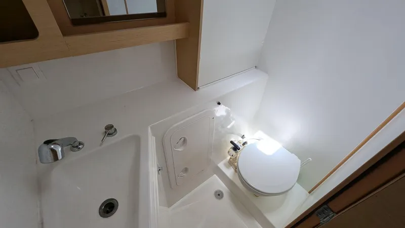 Mango IV Yacht Photos Pics Bathroom interior of 2017 Lagoon 42 catamaran, featuring sink and toilet.