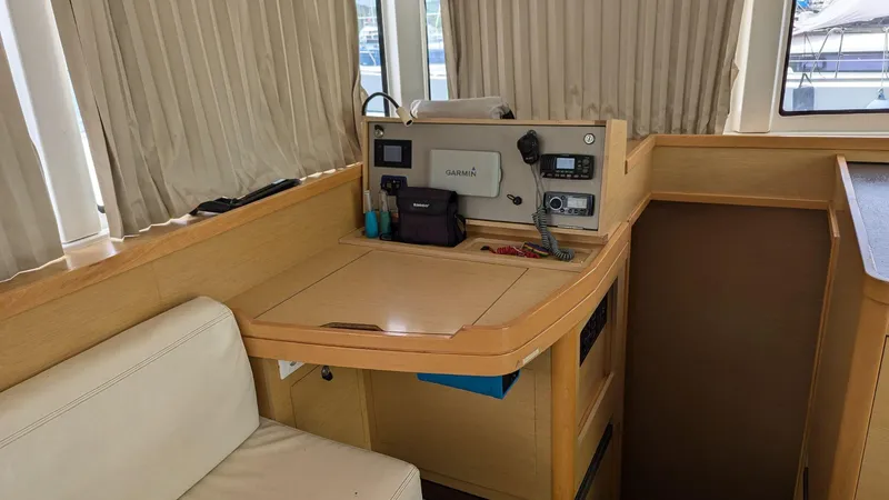 Mango IV Yacht Photos Pics Interior of 2017 Lagoon 42 yacht with navigation equipment and seating area.