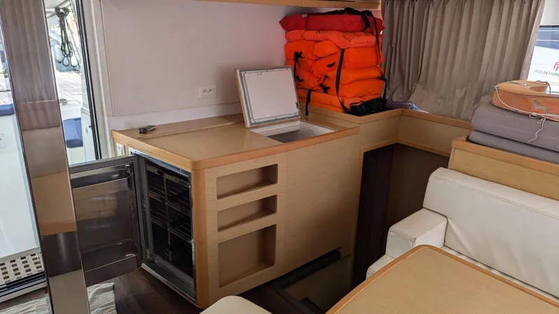 Mango IV Yacht Photos Pics Interior of 2017 Lagoon 42 catamaran with open fridge and life jackets.