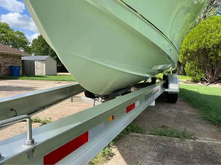  Yacht Photos Pics 2022 Sea Hunt Gamefish 27 on trailer, parked in driveway, side view.