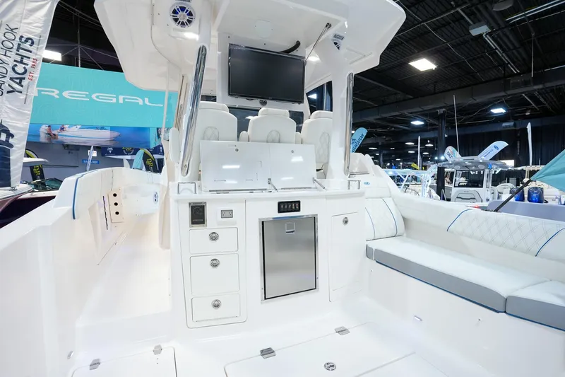  Yacht Photos Pics 2025 Regal 33 SAV boat interior with seating and control panel.