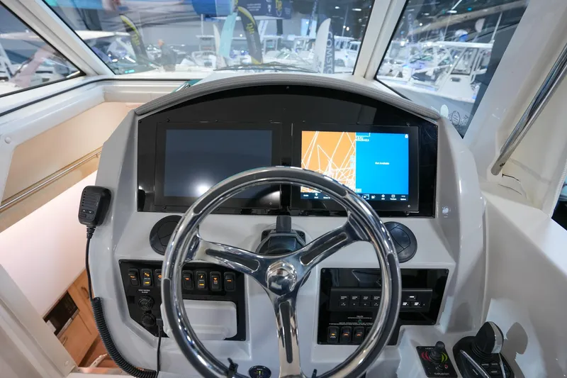  Yacht Photos Pics 2025 Regal 33 SAV boat dashboard with modern navigation displays and controls.