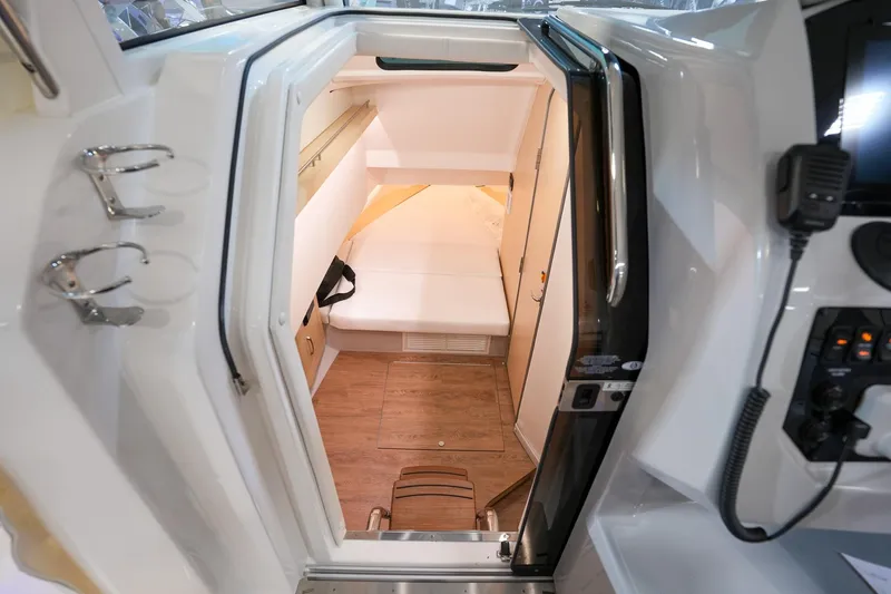  Yacht Photos Pics Interior cabin of 2025 Regal 33 SAV boat with modern amenities.