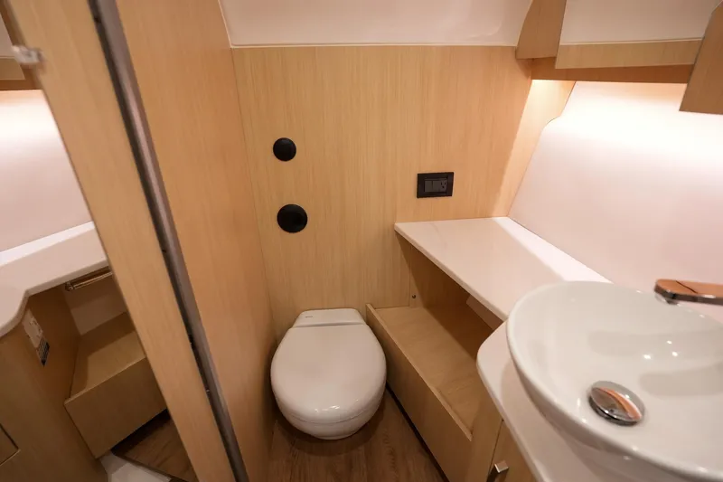  Yacht Photos Pics Modern bathroom interior in 2025 Regal 33 SAV boat, featuring sleek design and compact fixtures.