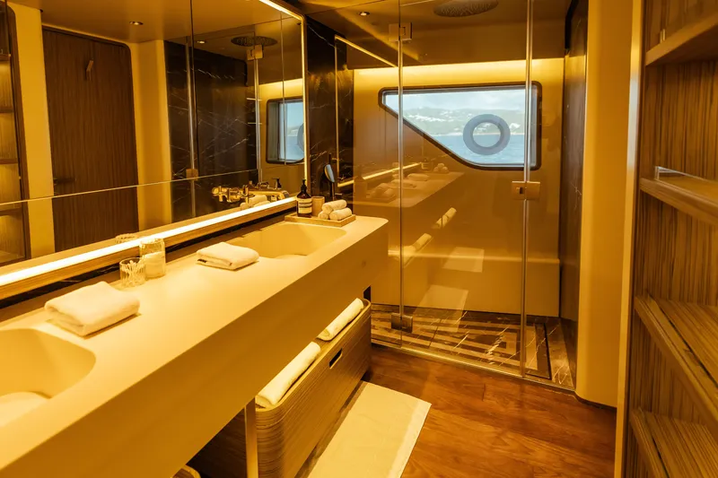  Yacht Photos Pics Luxurious bathroom on 2022 Custom Line Navetta 30 yacht with dual sinks and ocean view.