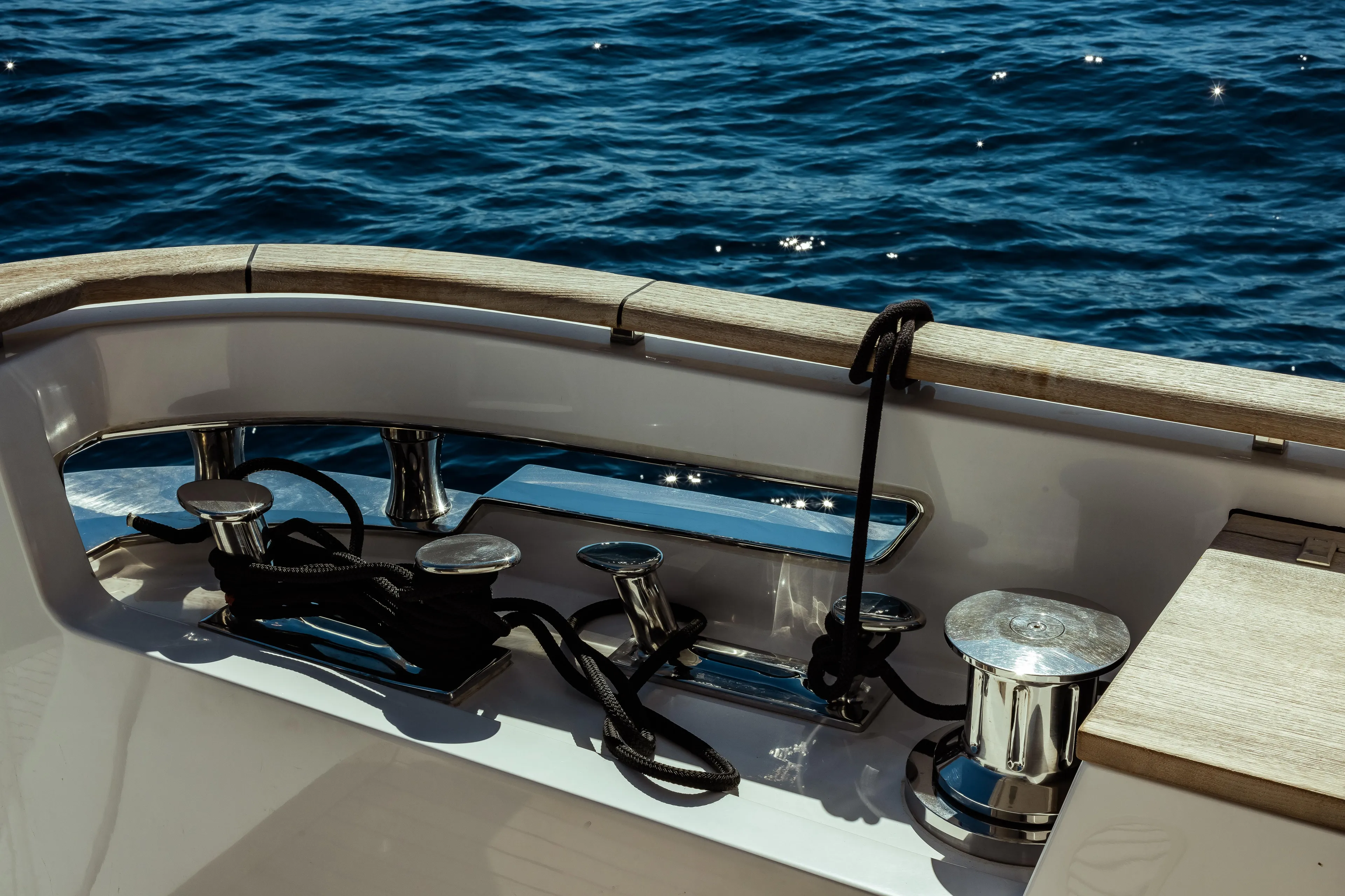 Luxury yacht Custom Line Navetta 30, 2022 model, deck view with ocean backdrop.
