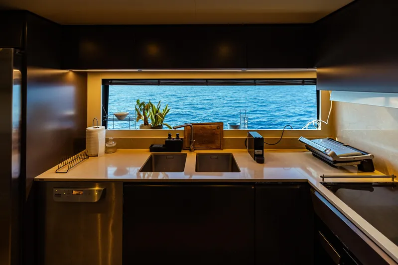  Yacht Photos Pics Luxurious kitchen on 2022 Custom Line Navetta 30 yacht with ocean view.