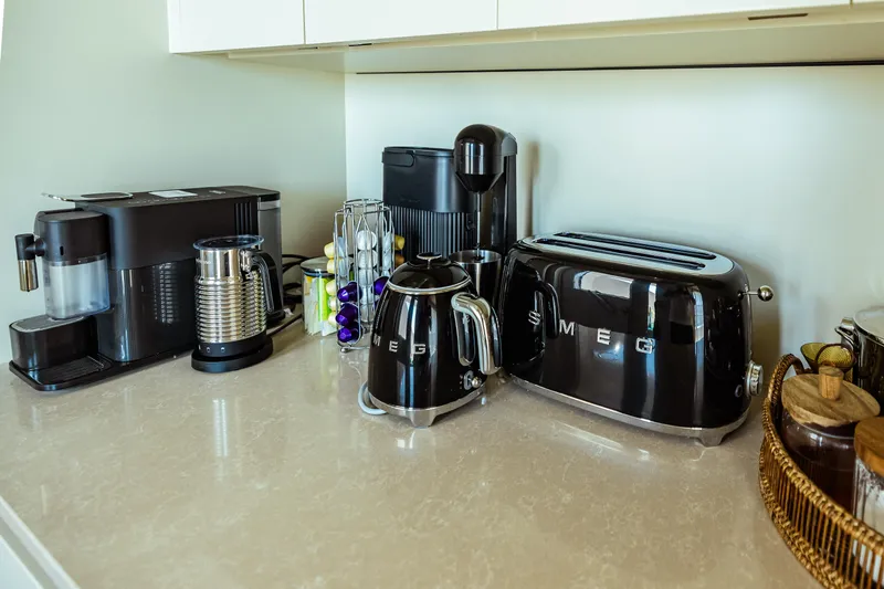  Yacht Photos Pics Modern kitchen appliances on countertop in Custom Line Navetta 30 yacht, 2022 model.