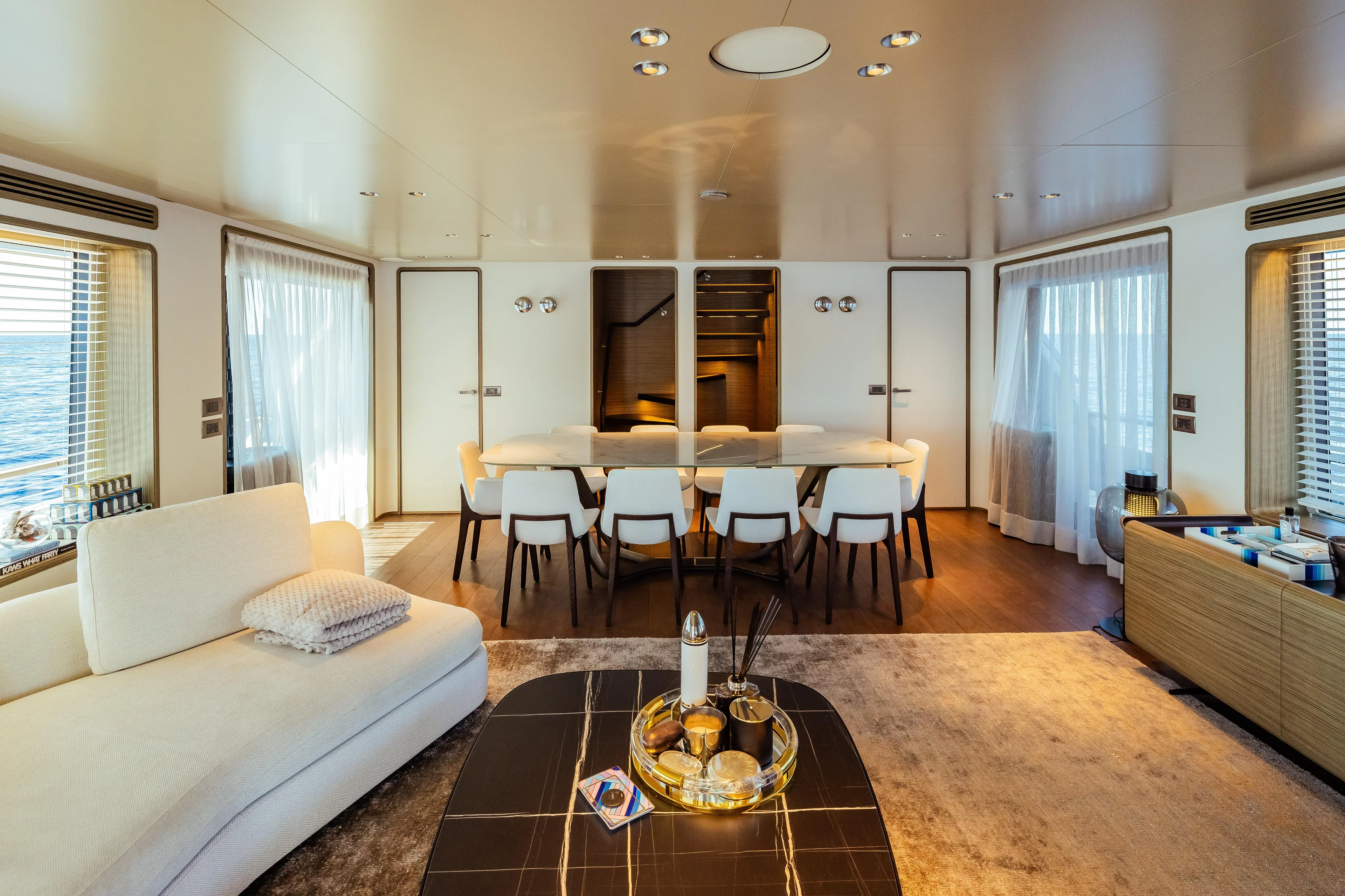  Yacht Photos Pics Luxurious interior of 2022 Custom Line Navetta 30 yacht, featuring elegant dining and living area.