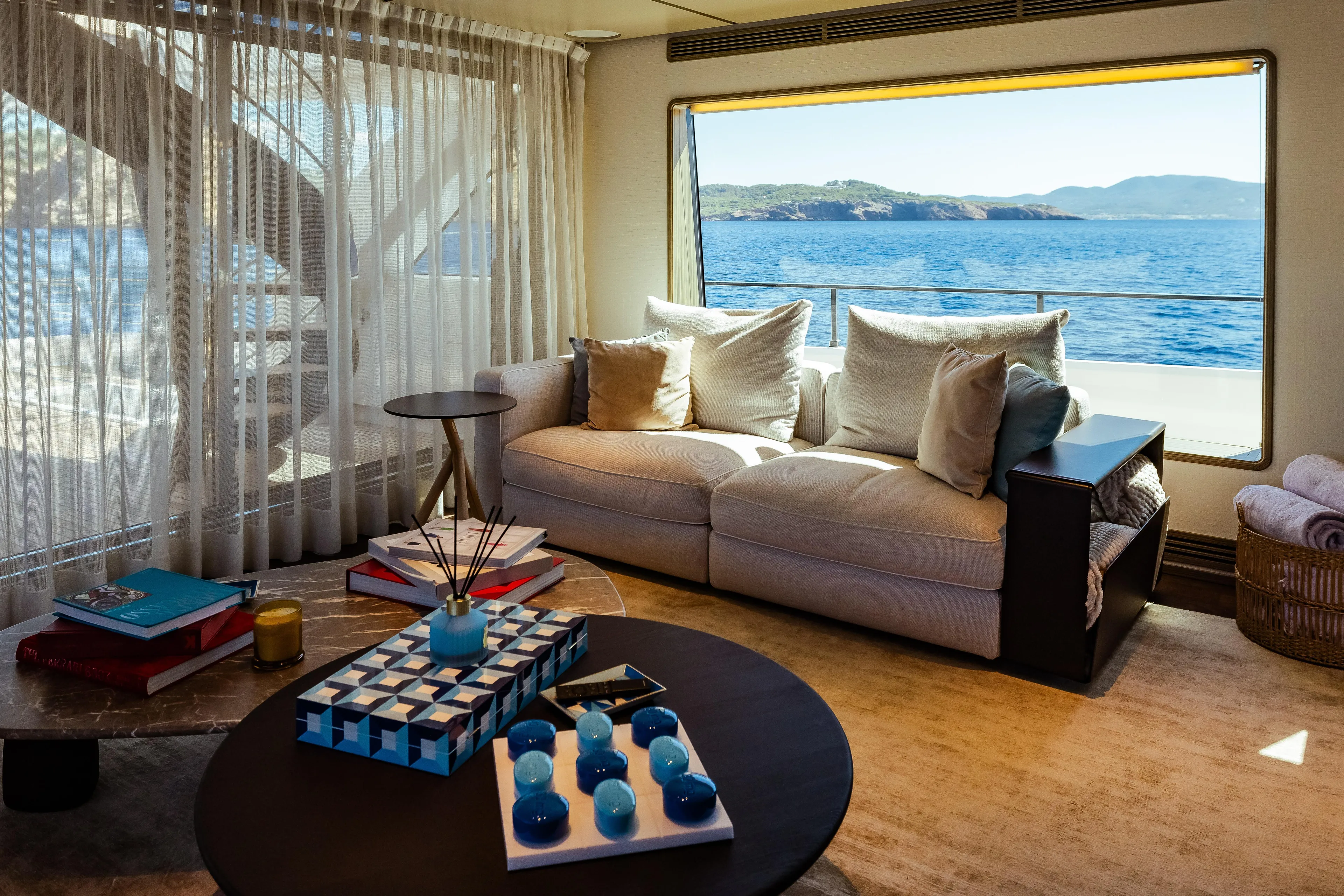 Luxurious 2022 Custom Line Navetta 30 yacht interior with ocean view and elegant decor.