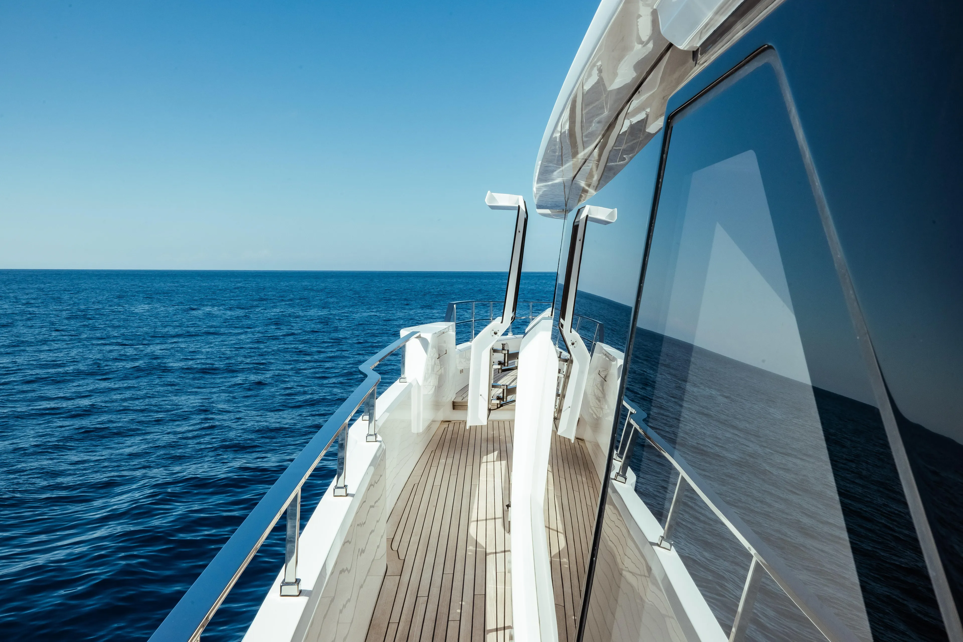  Yacht Photos Pics Luxurious Custom Line Navetta 30 yacht deck, 2022 model, cruising on open sea.