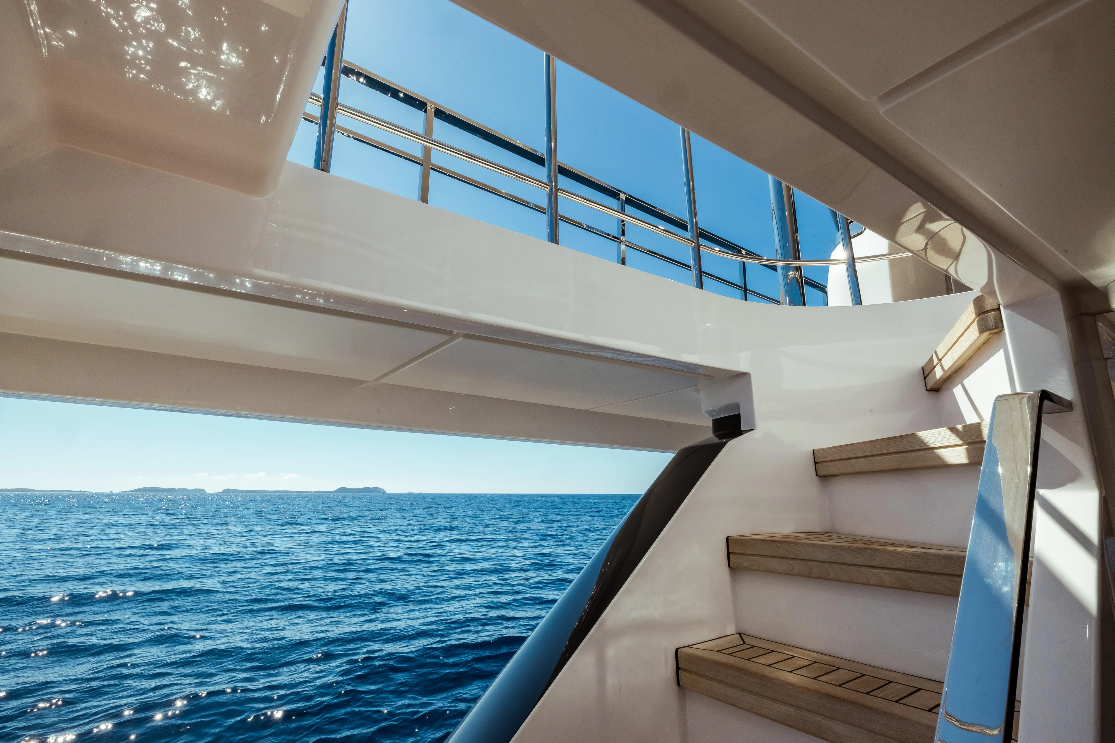  Yacht Photos Pics Staircase view on 2022 Custom Line Navetta 30 yacht overlooking the ocean.