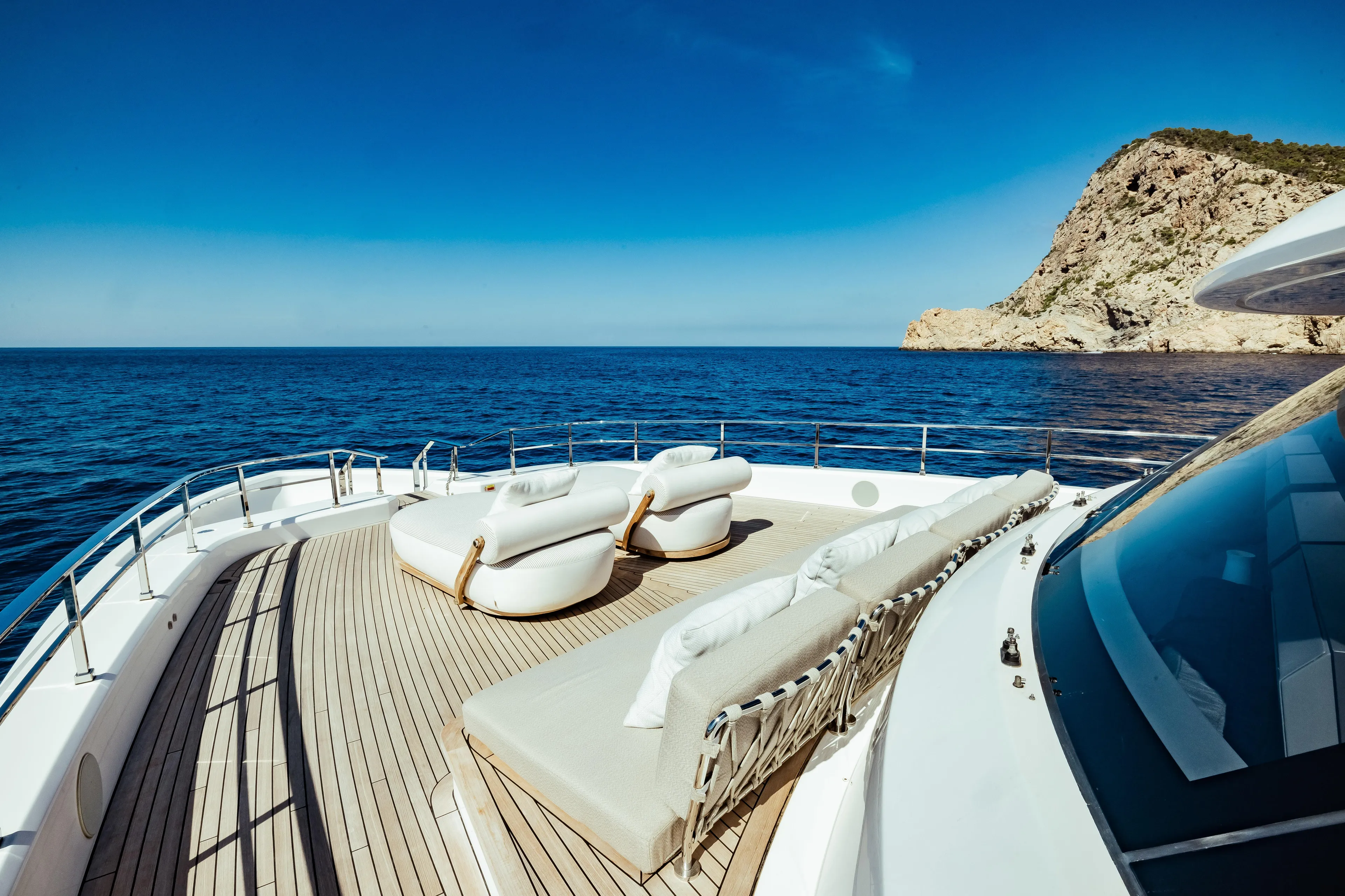  Yacht Photos Pics Luxurious 2022 Custom Line Navetta 30 yacht deck with ocean view and comfortable seating.