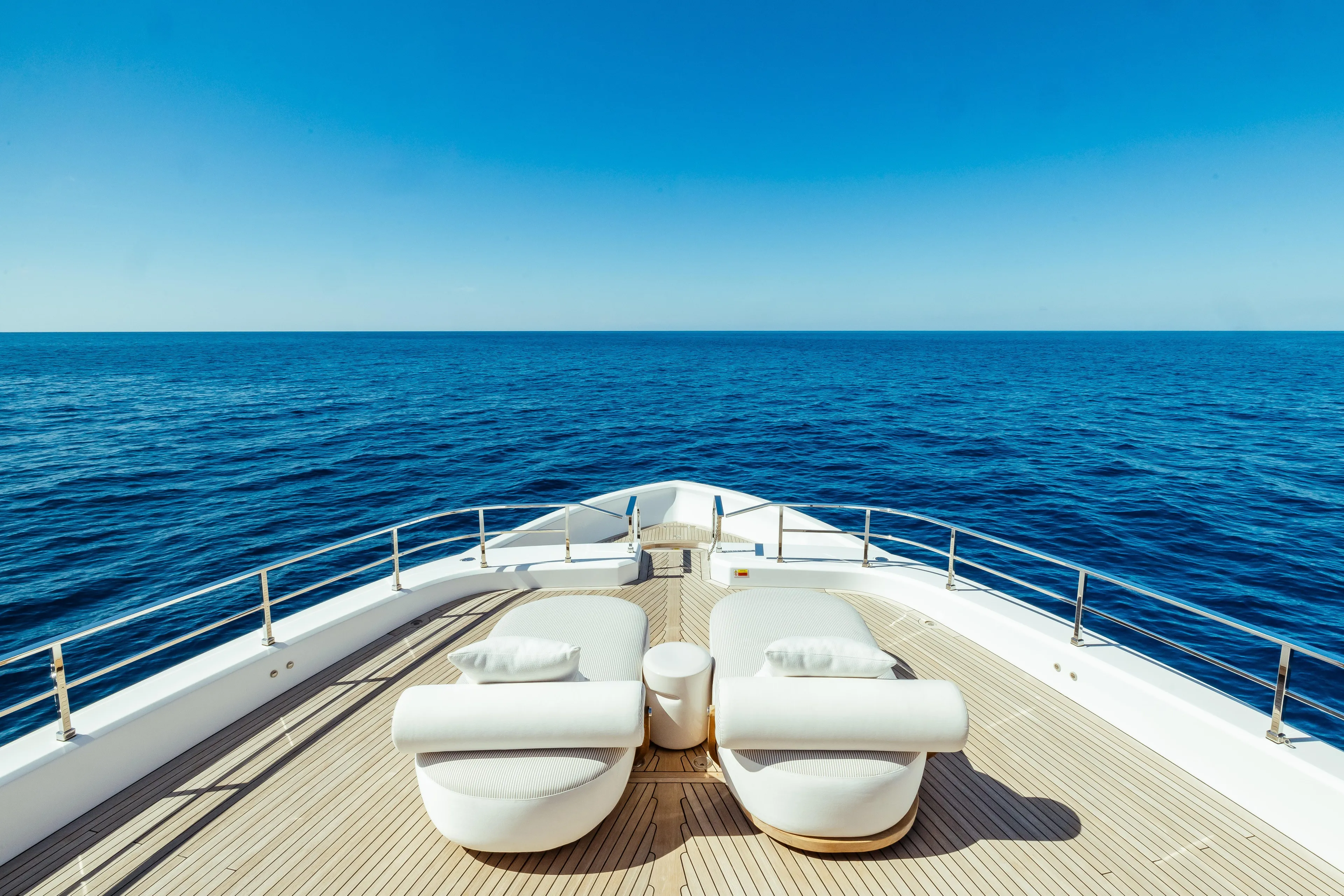  Yacht Photos Pics Luxurious 2022 Custom Line Navetta 30 yacht deck with ocean view and elegant seating.