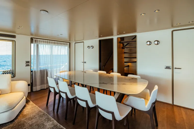  Yacht Photos Pics Luxurious dining area on 2022 Custom Line Navetta 30 yacht with ocean view.
