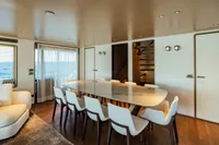 Luxurious dining area on 2022 Custom Line Navetta 30 yacht with ocean view.
