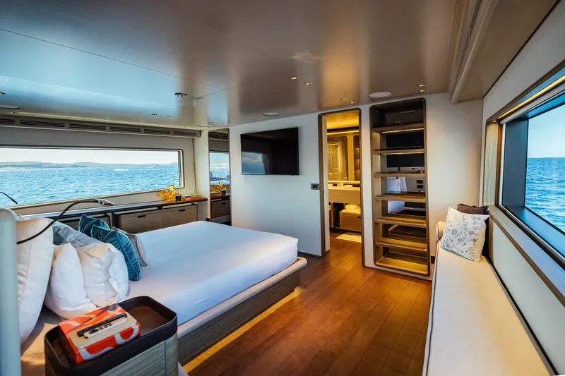  Yacht Photos Pics Luxurious bedroom interior of 2022 Custom Line Navetta 30 yacht with ocean view.