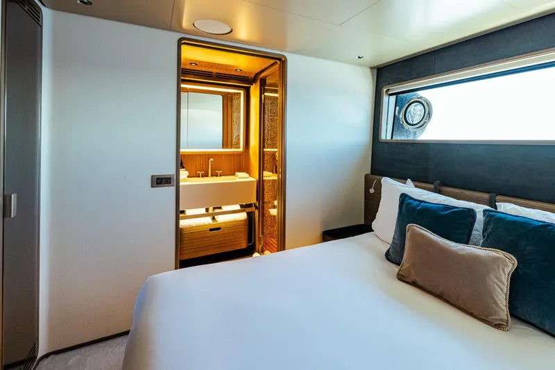  Yacht Photos Pics Luxurious bedroom and bathroom on 2022 Custom Line Navetta 30 yacht.