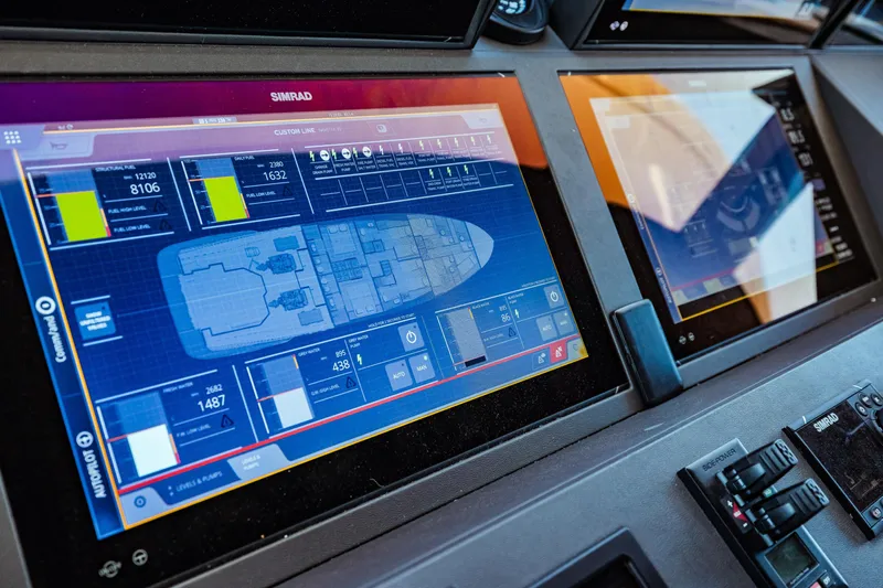  Yacht Photos Pics Control panel of 2022 Custom Line Navetta 30 yacht with navigation displays.