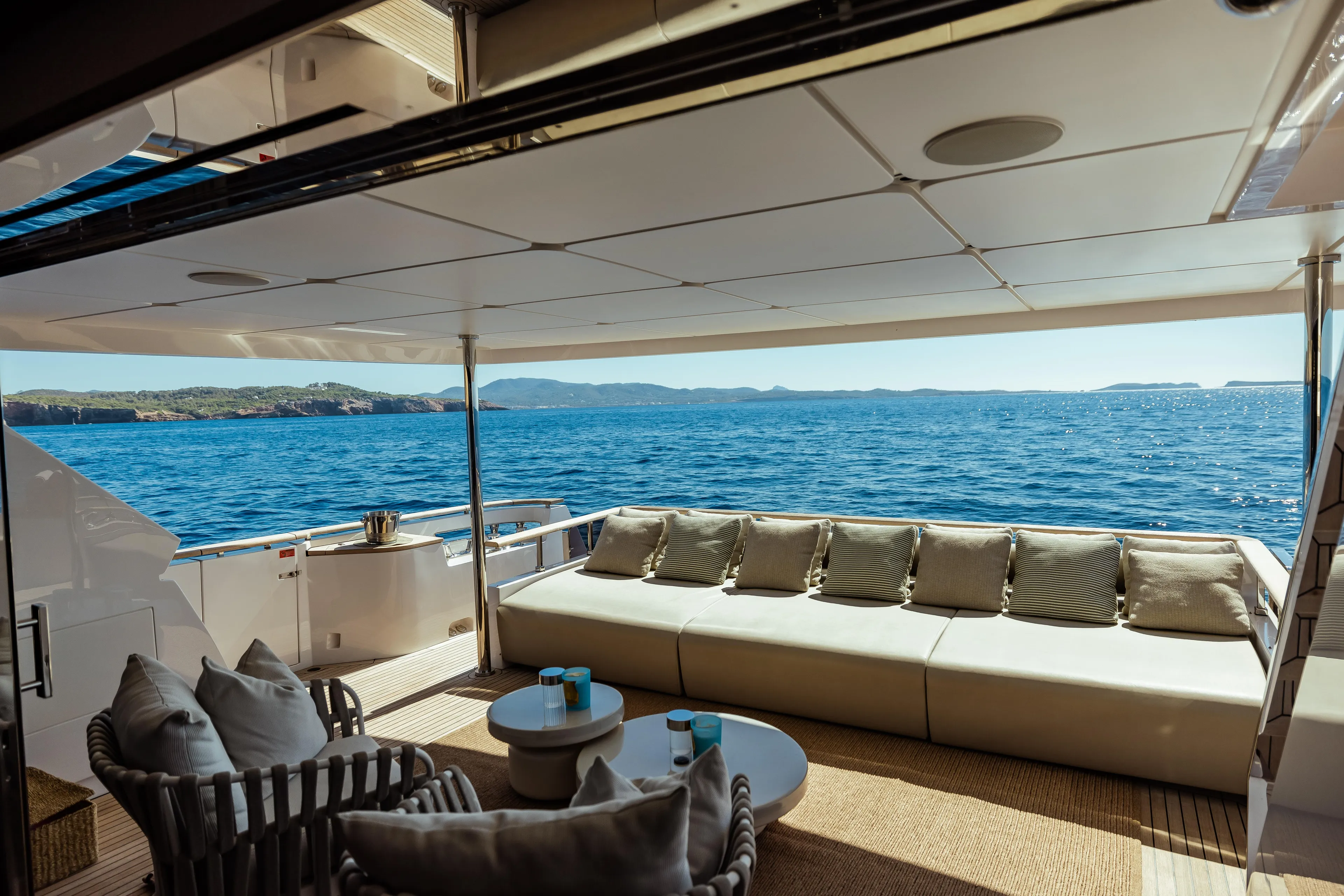 Luxurious 2022 Custom Line Navetta 30 yacht deck with ocean view and elegant seating.