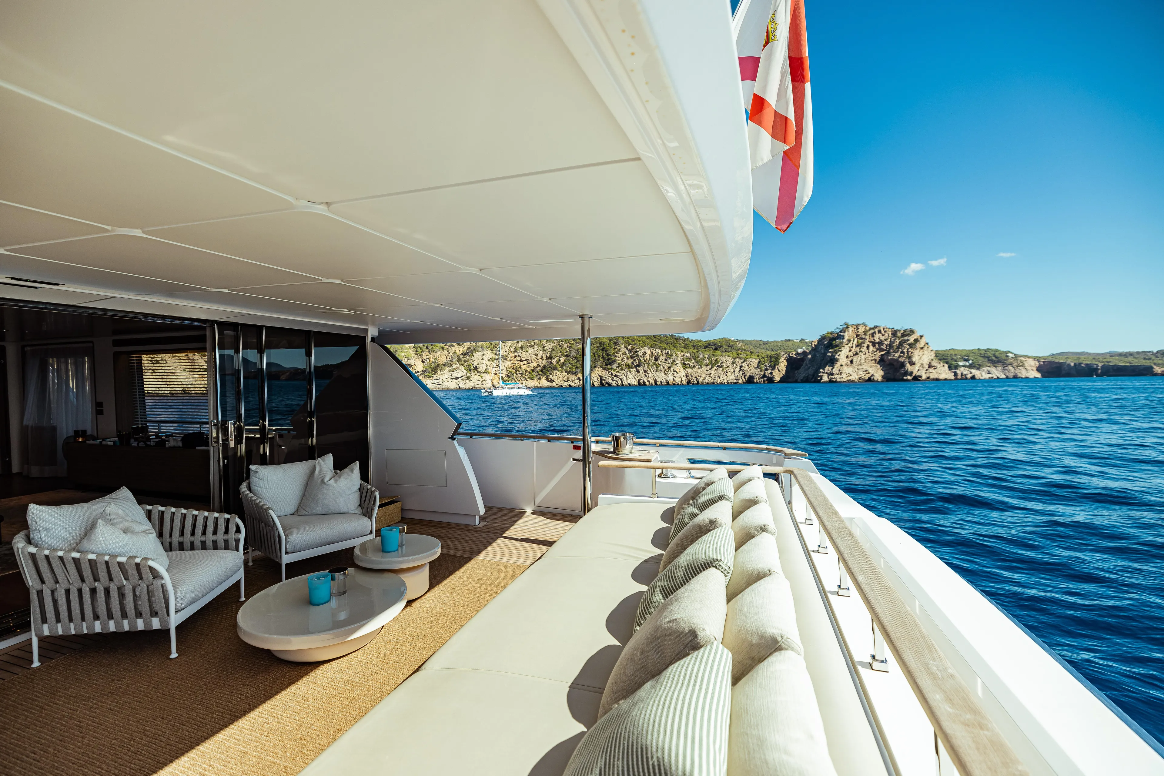  Yacht Photos Pics Luxurious 2022 Custom Line Navetta 30 yacht deck with ocean view and elegant seating.