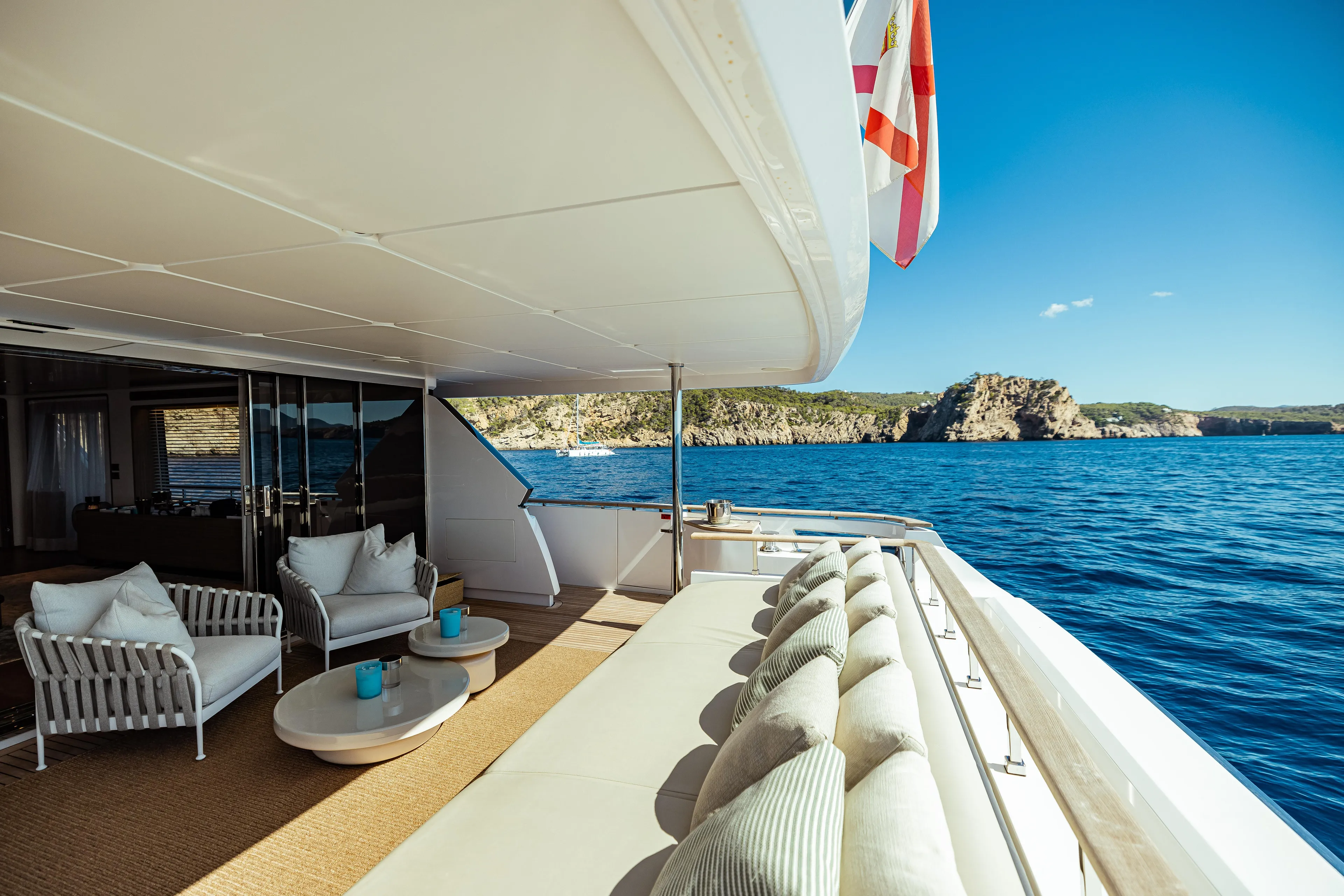Luxurious 2022 Custom Line Navetta 30 yacht deck with ocean view and elegant seating.